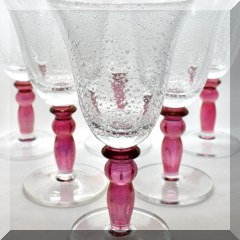 G21. 12 bubble glass goblets with red stems 8”h - $48